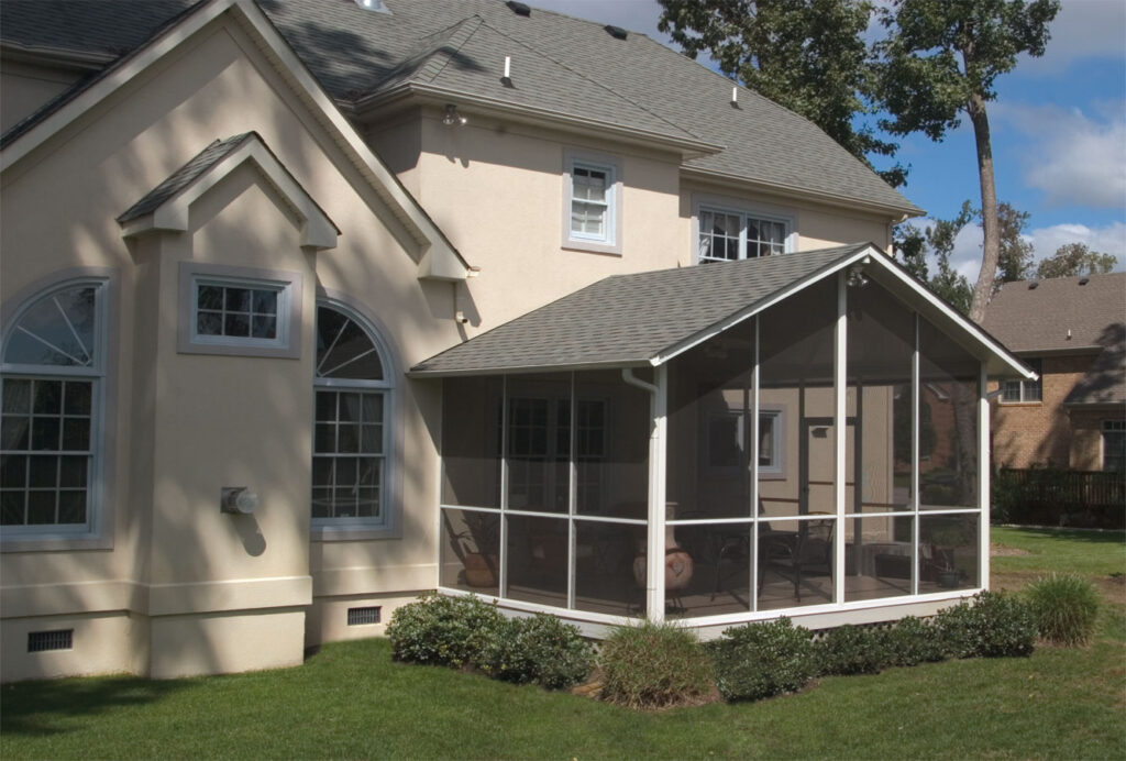 Screen Room Definition and Purpose Screen room attached to a home with mesh walls, shaded roof, and outdoor seating in a Houston backyard