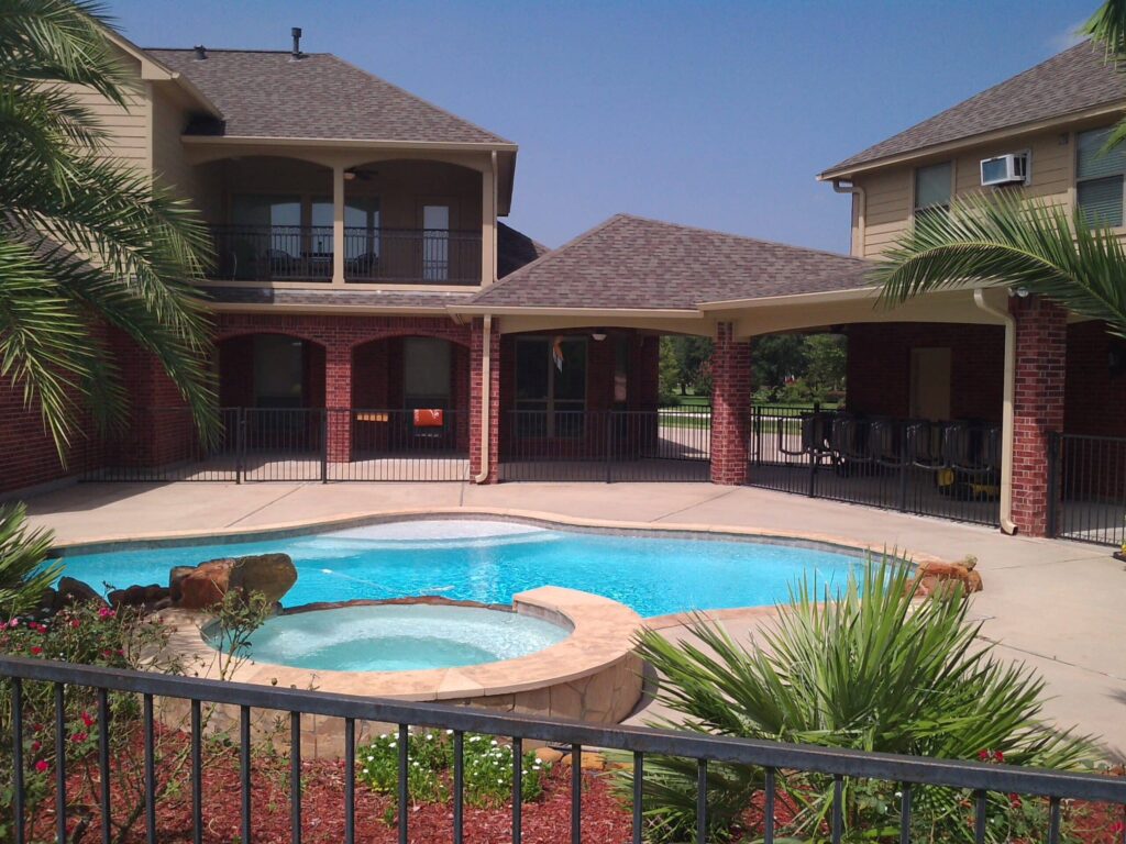 Arched screen patio enclosure with elegant curved design installed in Tomball TX by 21st Century Sunrooms