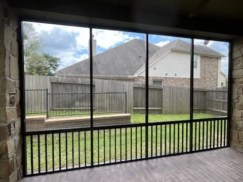 Bronze finish screen enclosure with aluminum construction creating warm-toned outdoor space by 21st Century Sunrooms Houston TX