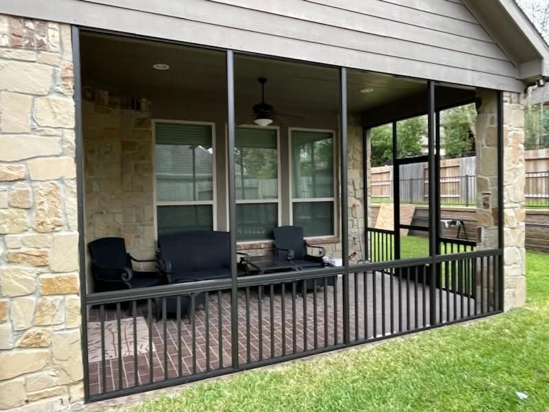 Bronze colored screen enclosure with matching aluminum frame and screening by 21st Century Sunrooms Houston TX