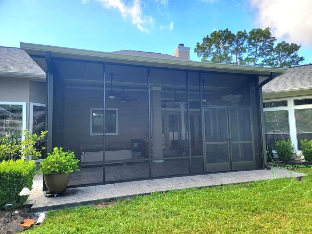 Screen room enclosure with aluminum frame and mesh screening installed in Kingwood TX by 21st Century Sunrooms