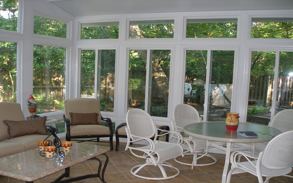 Custom sunroom with aluminum frame and glass panels installed in Houston by 21st Century Sunrooms
