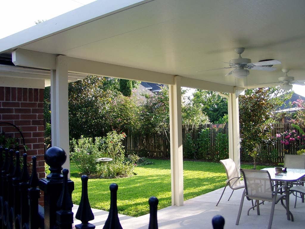 Durable insulated patio covers providing shade and weather protection on Houston homes by 21st Century Sunrooms