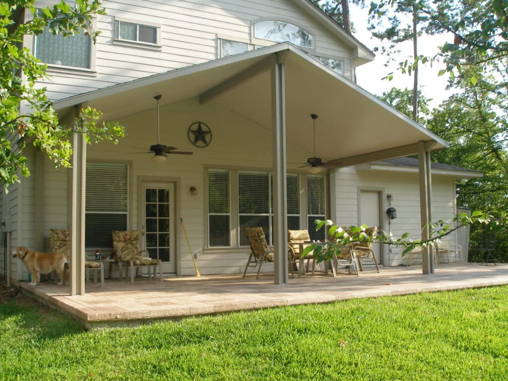 Gabled patio cover with peaked roof design installed over concrete patio by 21st Century Sunrooms Houston TX