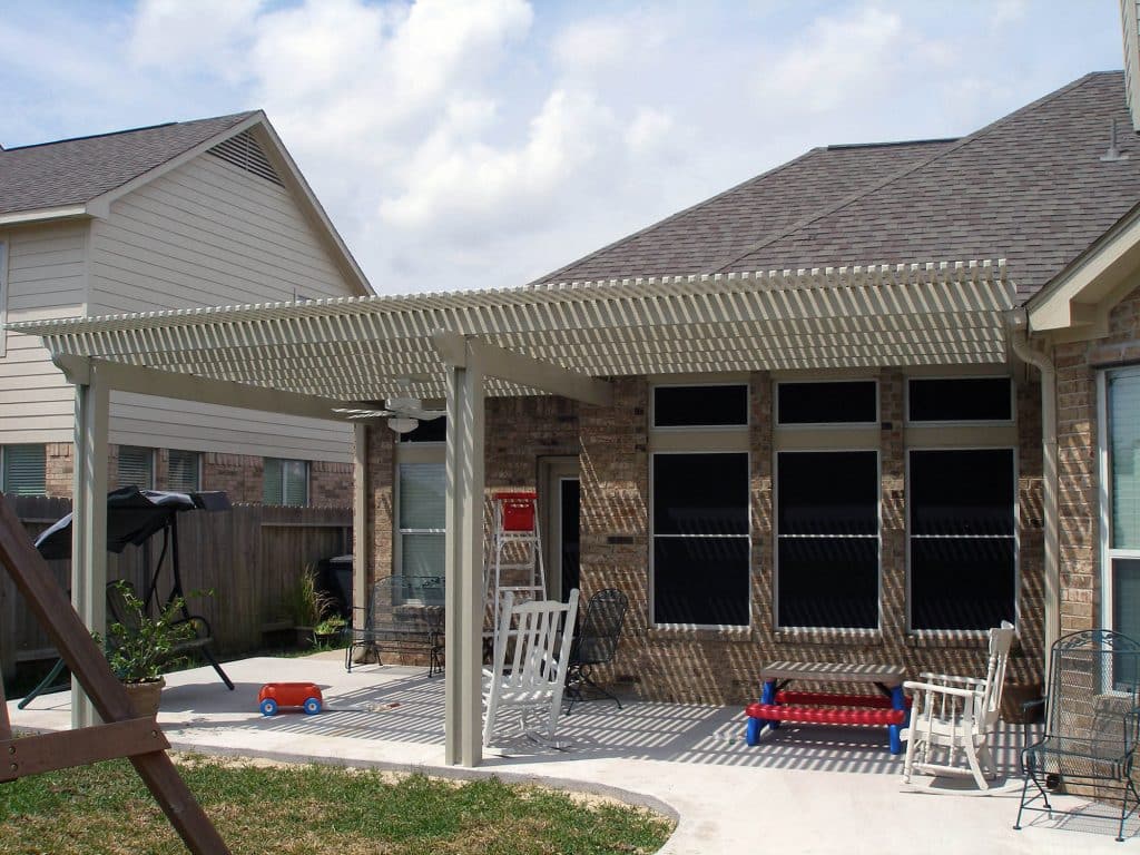 Lattice arbor transforming backyard with architectural beauty and shade by 21st Century Sunrooms Houston TX