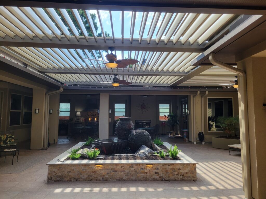 Outdoor space maximized with Equinox louvered roof creating versatile living area by 21st Century Sunrooms Houston TX