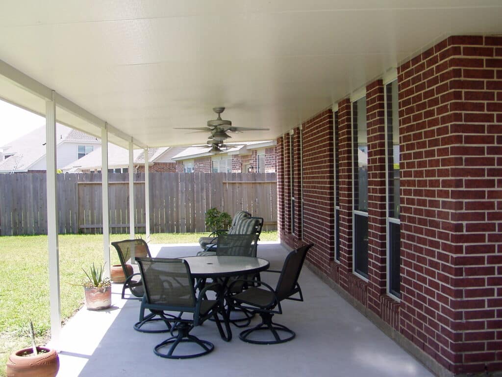 Job site photos of outdoor patio cover installations showing completed projects by 21st Century Sunrooms Houston TX