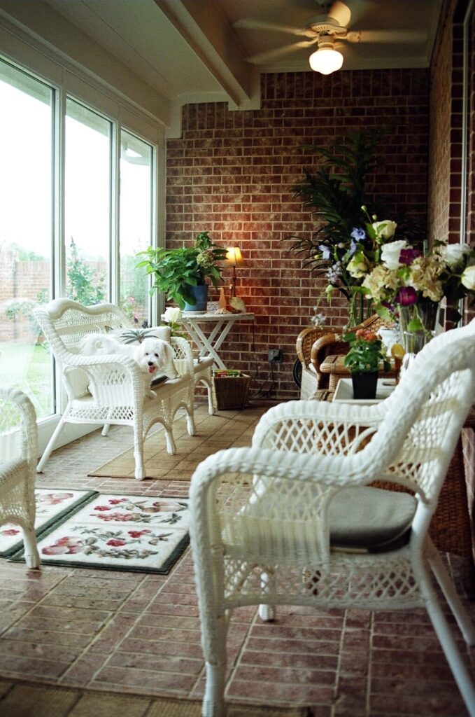 Patio enclosure converted to sunroom with windows and roof coverage by 21st Century Sunrooms Houston TX