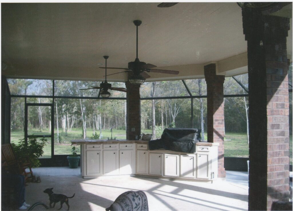 Custom patio enclosure with screen and glass panels installed in Montgomery TX by 21st Century Sunrooms