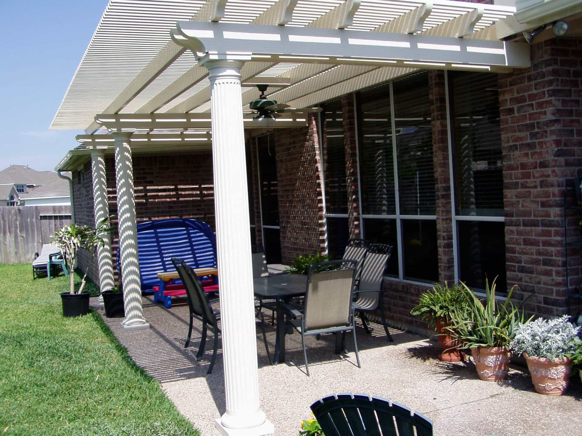 Pergola featuring decorative fluted columns adding classical elegance by 21st Century Sunrooms Houston TX