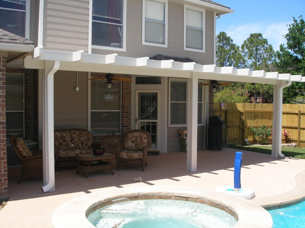 Patio cover with decorative Santa Fe trim details creating Southwestern style by 21st Century Sunrooms Houston TX