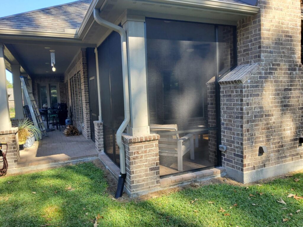 Screen patio enclosure with double door entry providing easy access by 21st Century Sunrooms Houston TX