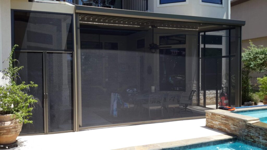 Screen patio enclosure featuring double screened doors for wide entry access by 21st Century Sunrooms Houston TX