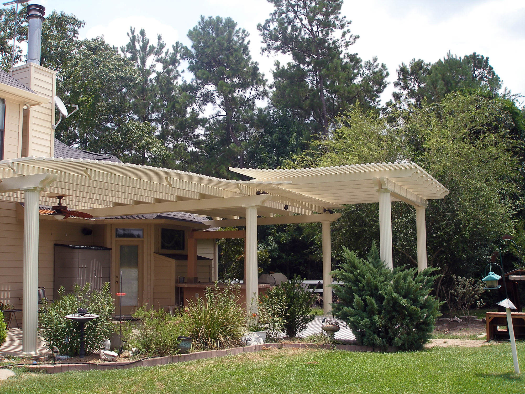 Split level lattice shade arbor with tiered design creating dimensional shade structure by 21st Century Sunrooms Houston TX