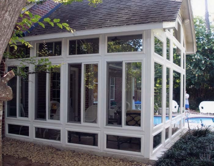 Sunroom addition with aluminum frame and large windows expanding home living space by 21st Century Sunrooms Houston TX