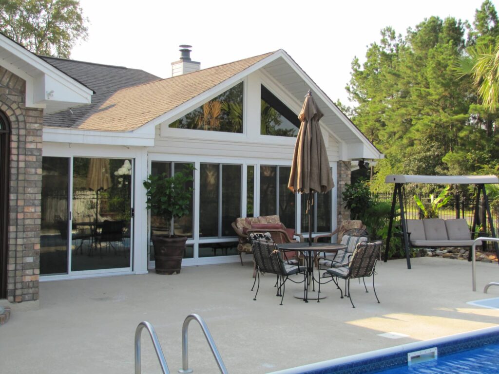 Sunroom after renovation showing transformation to bright living space by 21st Century Sunrooms Houston TX