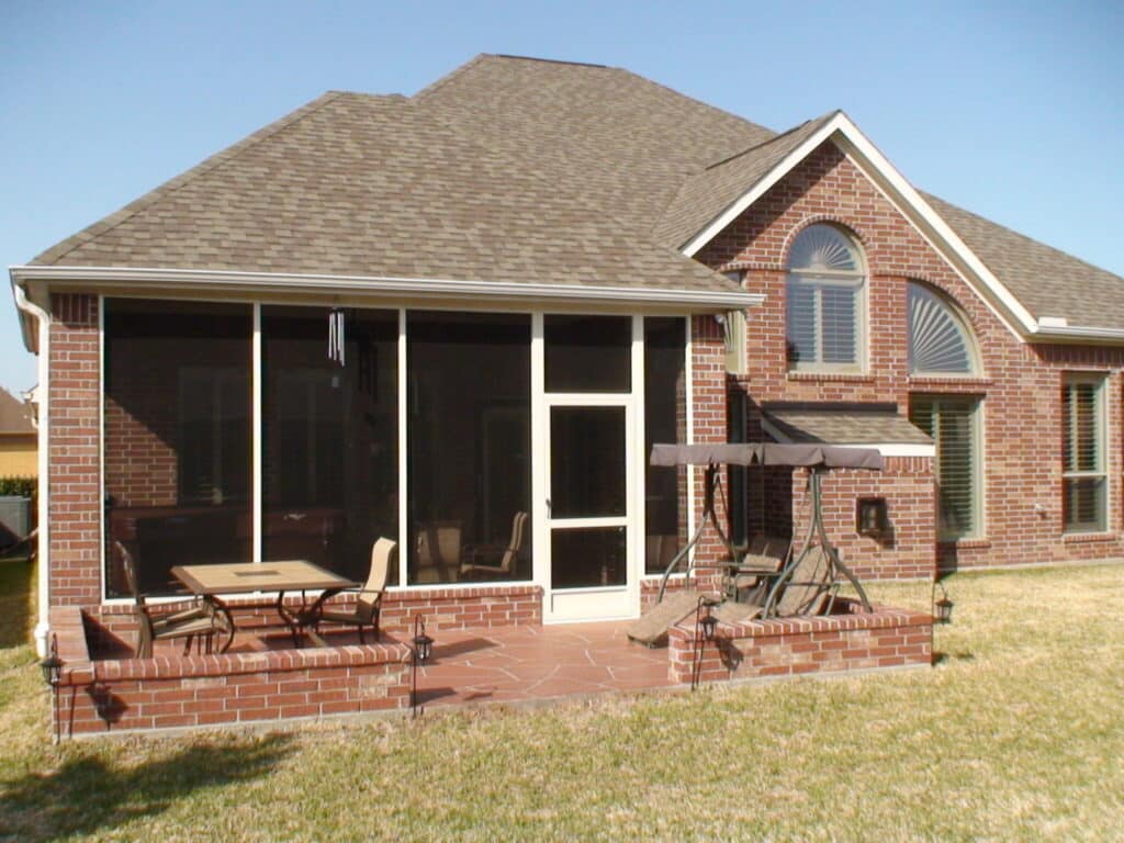 Why Houston Homeowners Love Screen Rooms Happy family enjoying their bug-free screen room by 21st Century Sunrooms Houston TX
